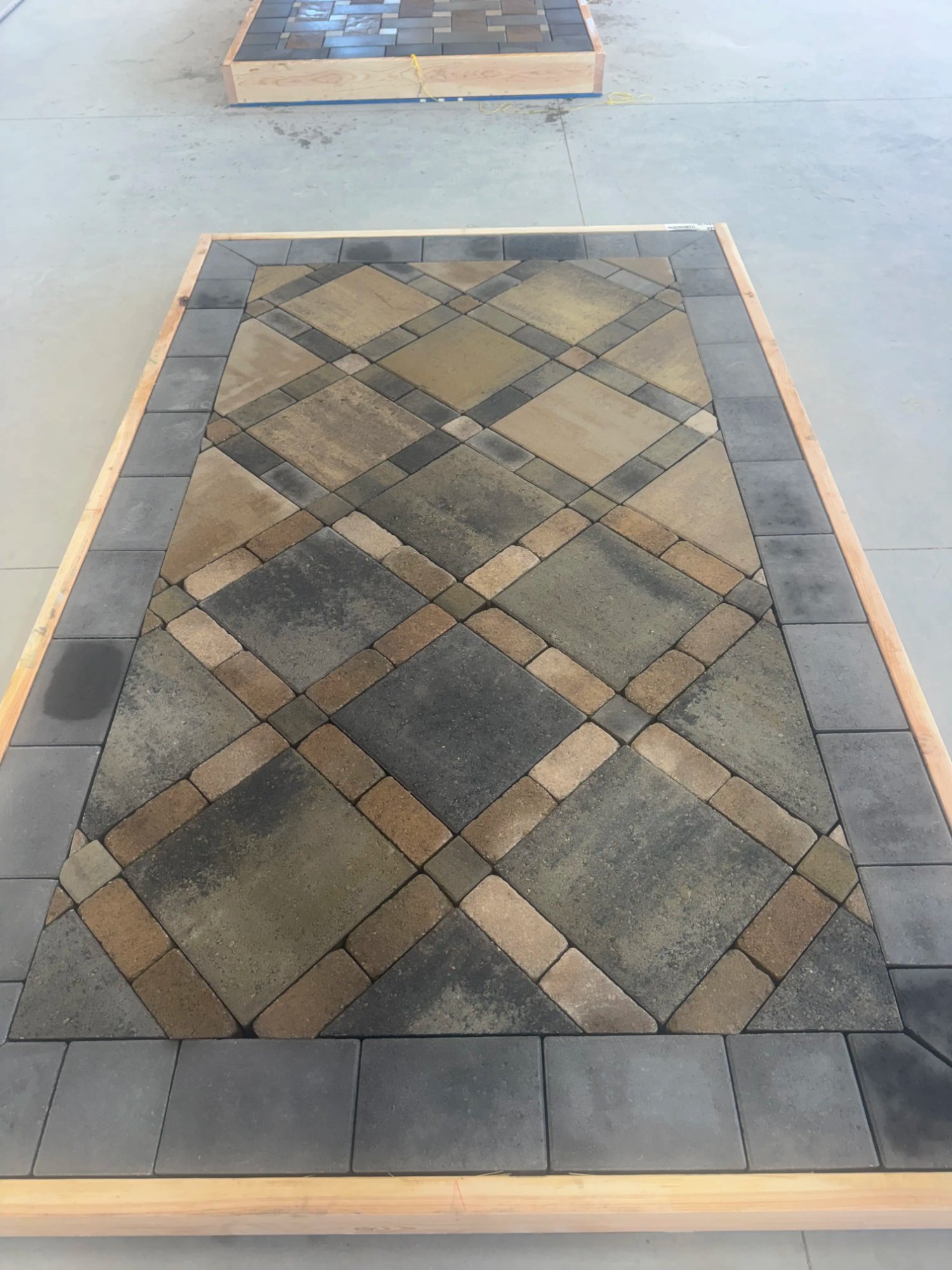Diagonal multicolor paver patio pattern installation by EC Landscaping in Layton Utah