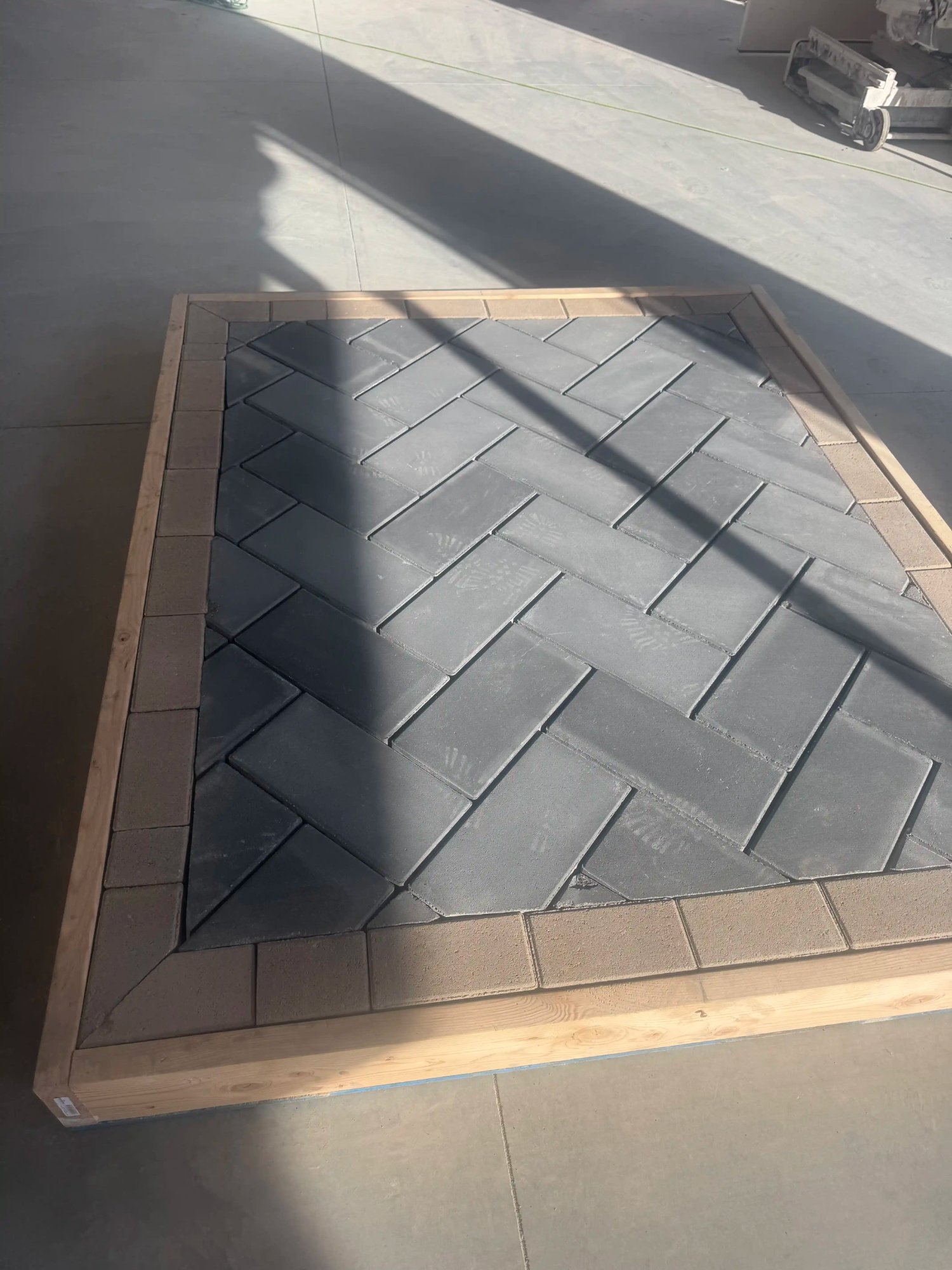 Herringbone charcoal paver patio professional installation by EC Landscaping in Layton Utah