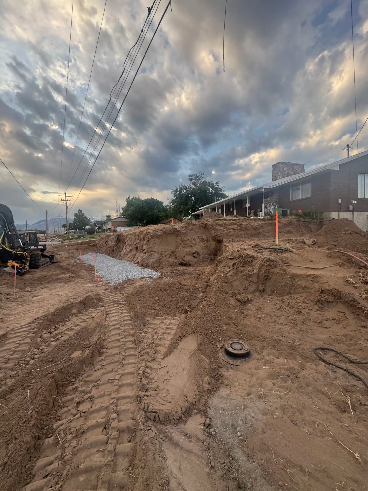 Professional site grading with skid steer equipment by EC Landscaping in Layton Utah