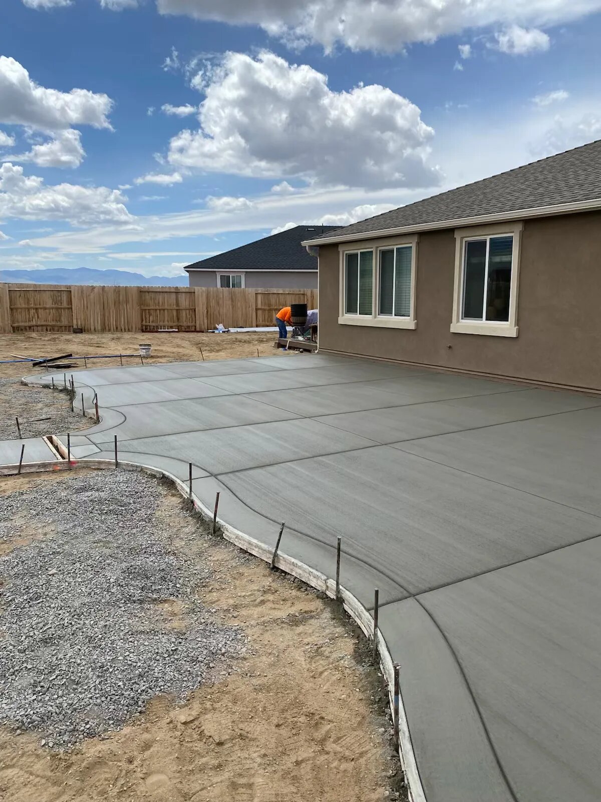 Large backyard concrete patio installation in Syracuse