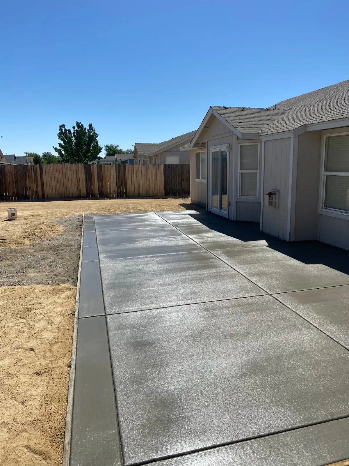Finished side-entry concrete patio