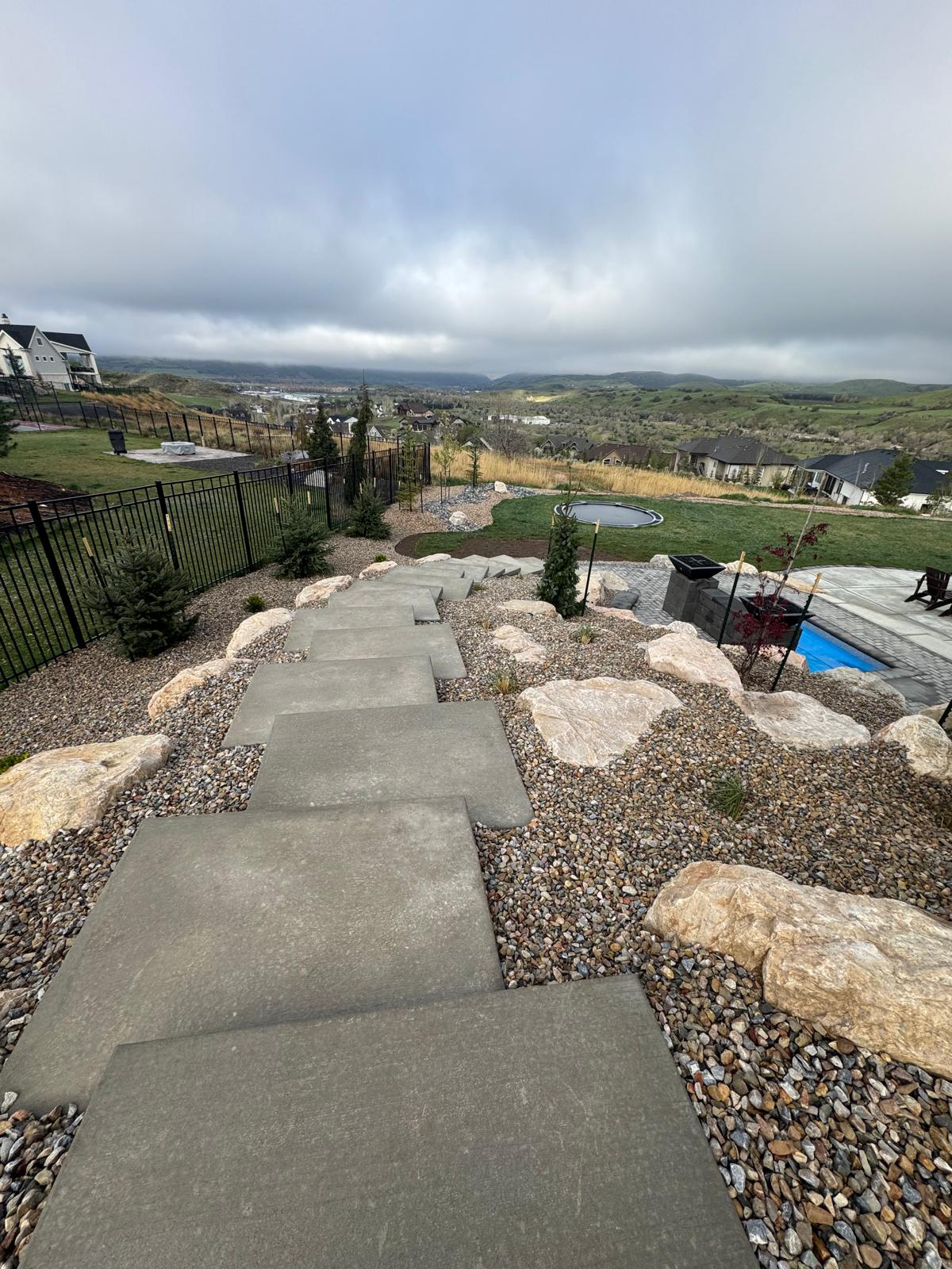 Lower view of hillside stepping stones and natural boulder retaining system, Northern Utah landscape