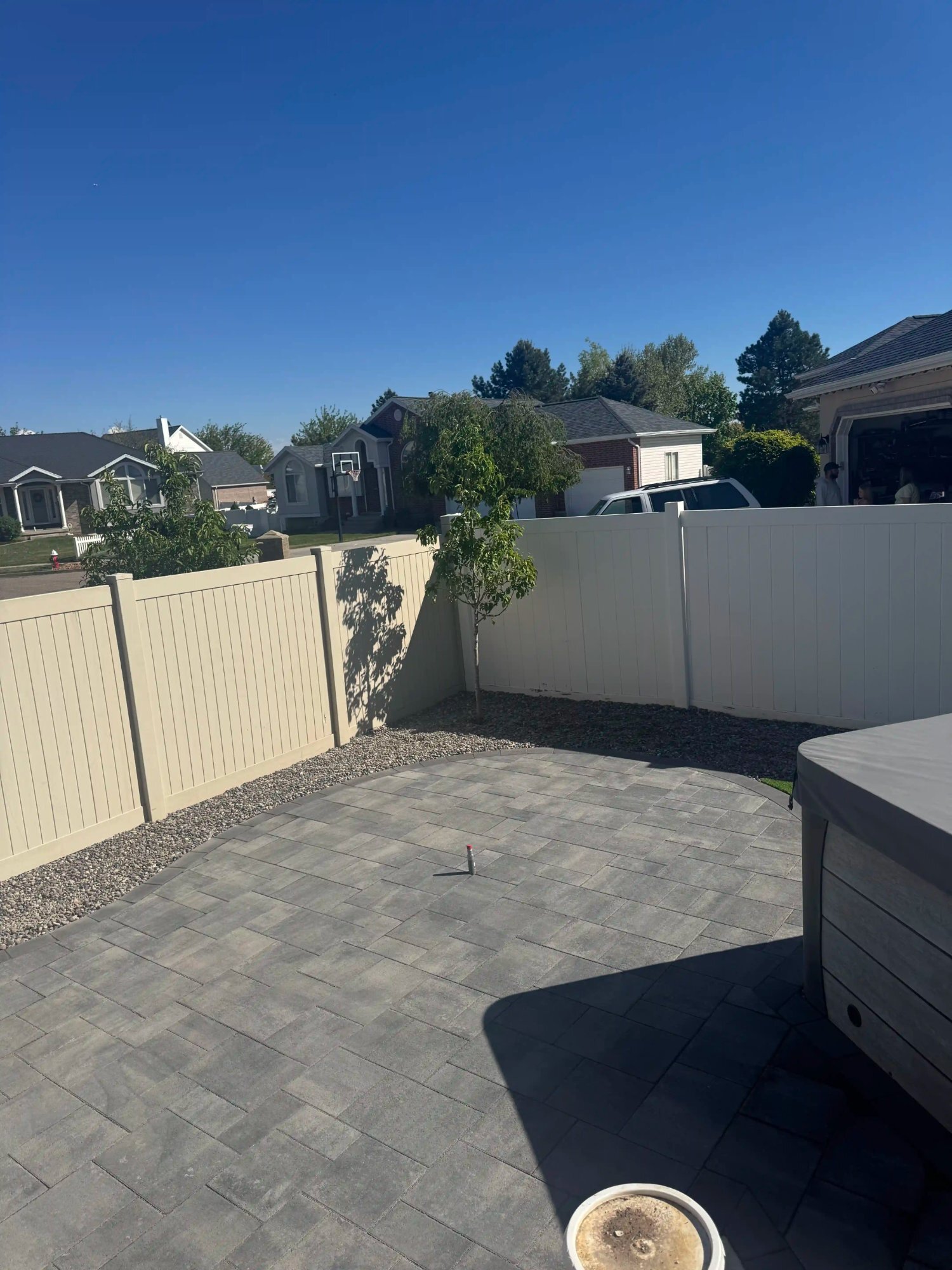 Dark gray paver patio with hot tub surround, Utah