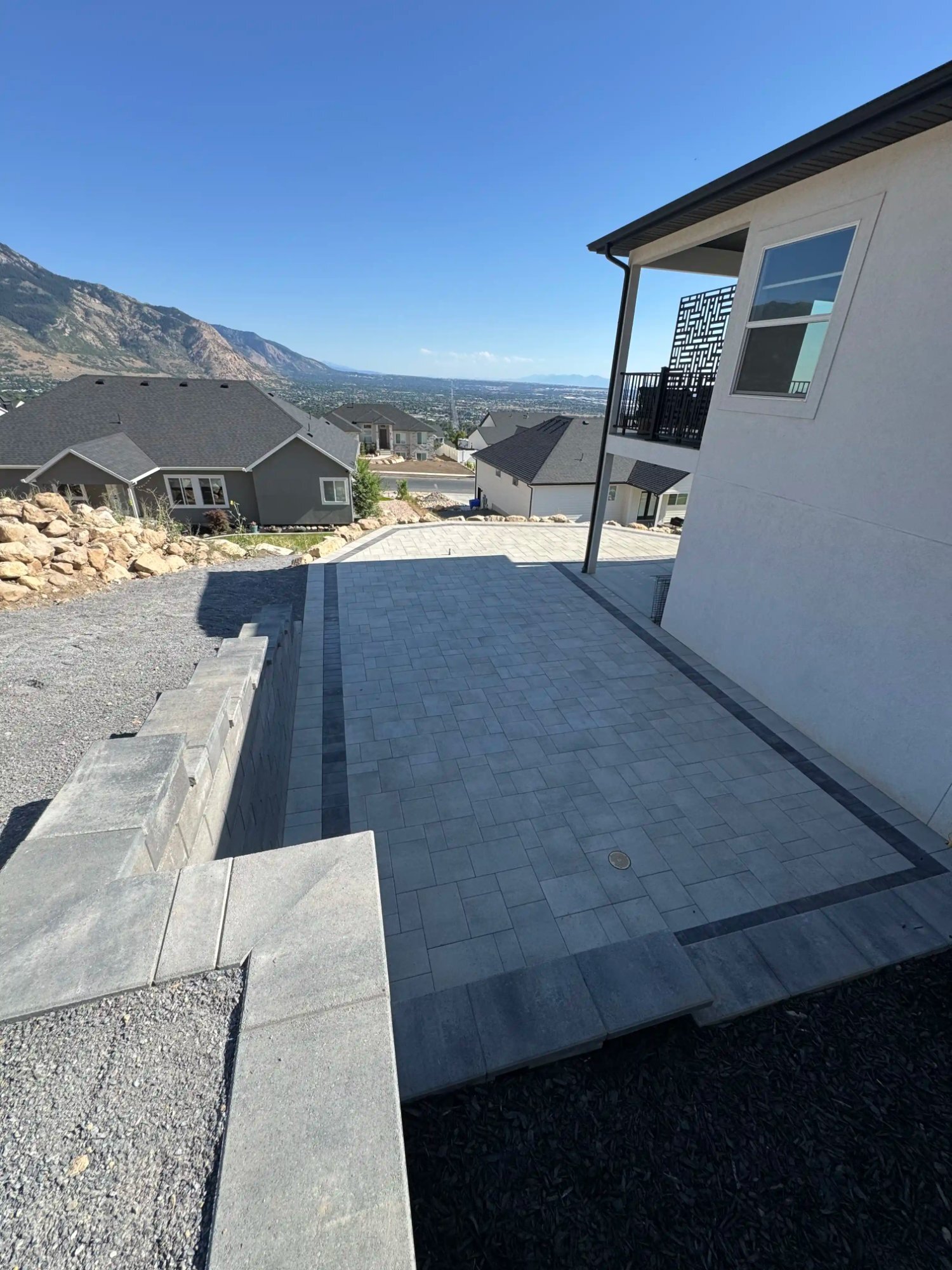 Hillside paver patio with mountain views in North Ogden