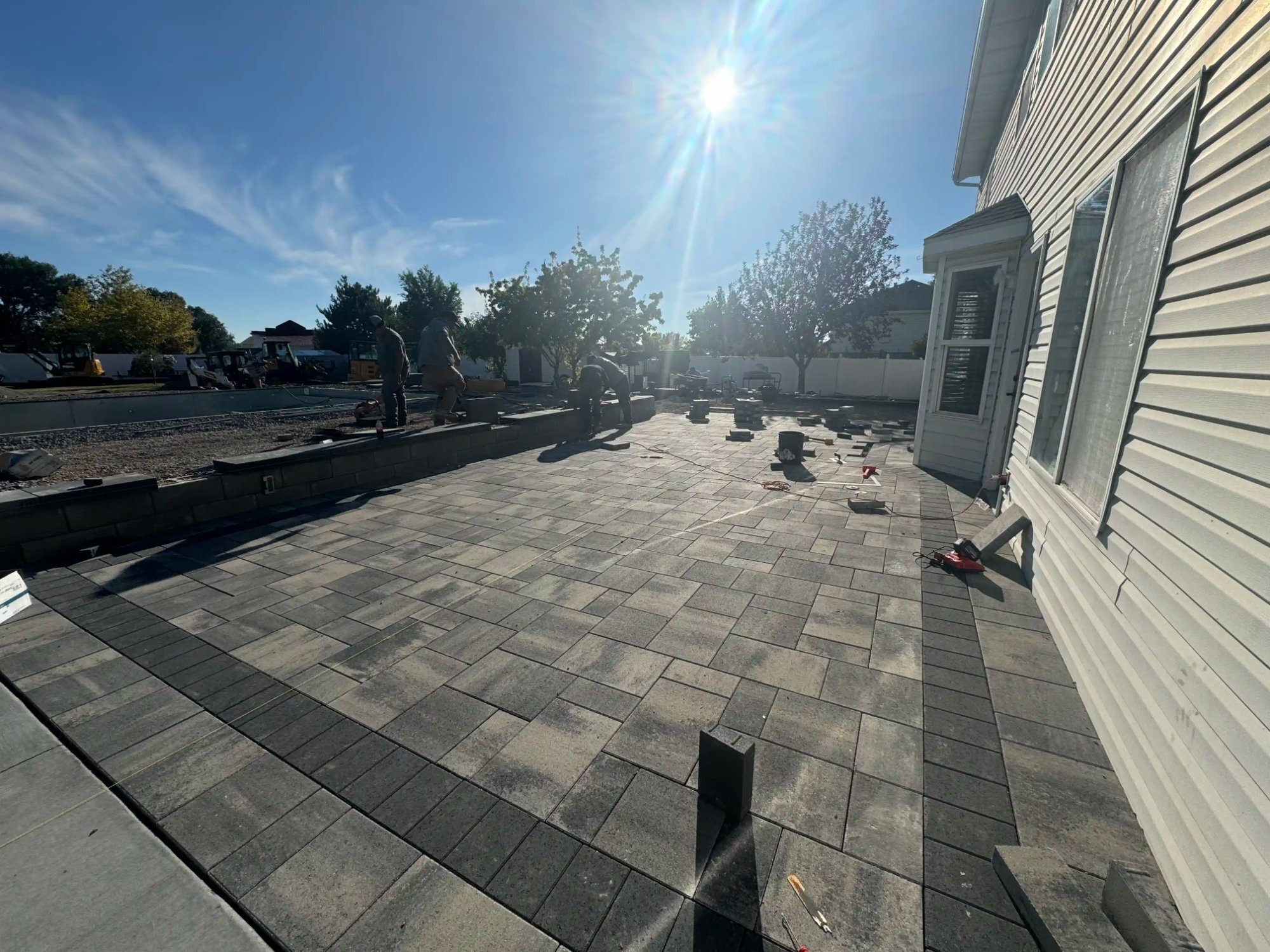 Dark charcoal paver patio installation