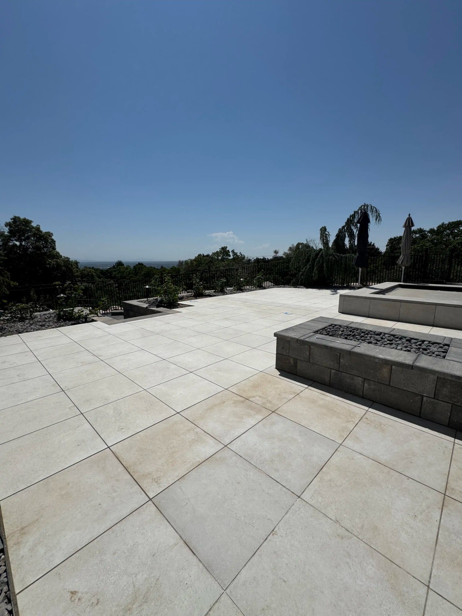 Luxury large-format paver patio fire pit Northern Utah