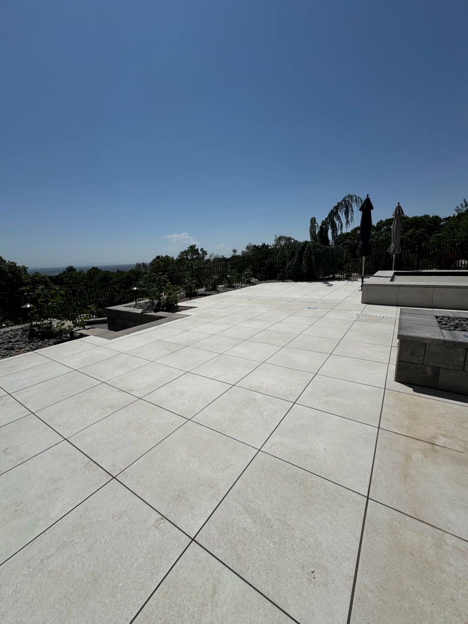 Large format hillside paver patio fire pit Utah