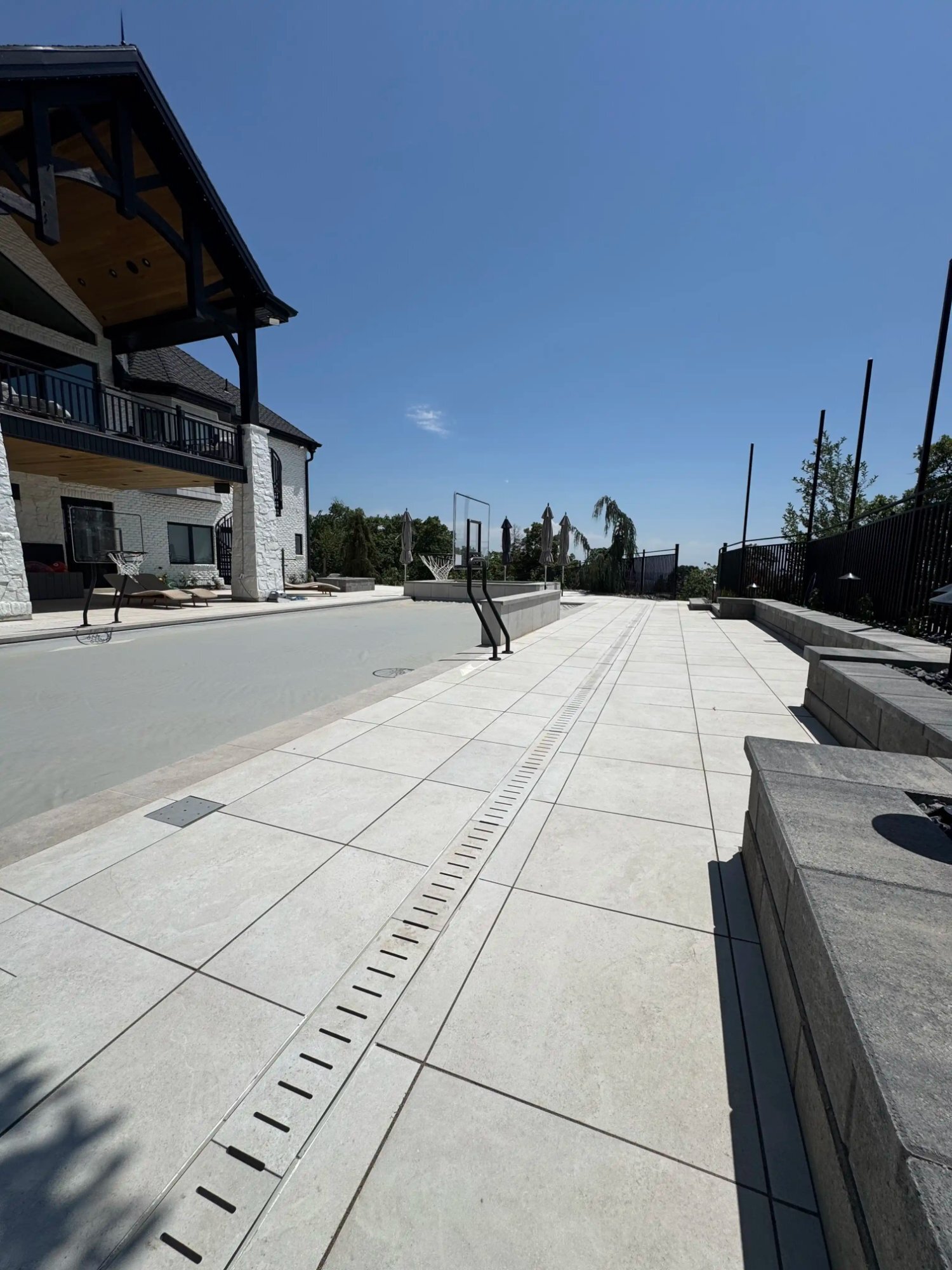 Luxury paver pool deck with linear drain Utah