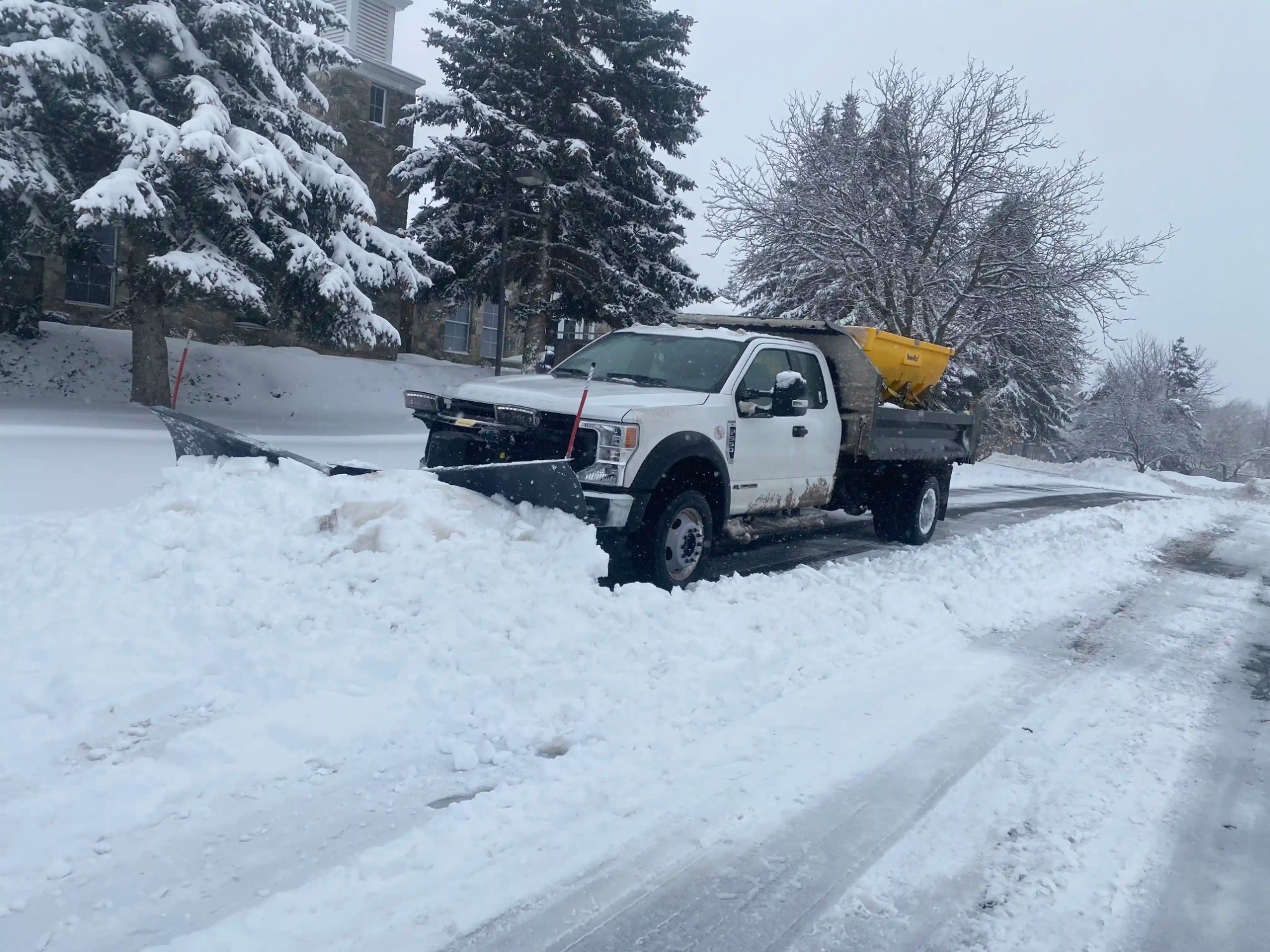 Snow plow truck in action Utah